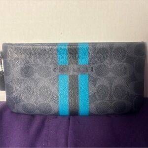 Coach wristlet Dark Gray with turquoise stripes! 9” length. 6 credit card slots.